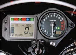 ><br /><b>600F Instruments</b></tr>
<p></TD></table>
<p>Like many other 2001 Honda models, the 600 receives a new, thin, light instrument panel, featuring several functions, including clock, engine temperature, and remaining fuel.</p>
<p>A lighter, yet more powerful, battery is another detail refinement to the CBR600F4.</p>
<p>The “sport” model introduced in Europe includes even more “aggressive” styling, particularly at the rear of the bike.  The black aluminum frame is evident in the photograph.  While the standard model weighs 374 pounds (slightly lighter than the 2000), the sport model is approximately two pounds lighter still.</p>
<p>The 2001 VTR1000 Super Hawk has several refinements, as well.  With slightly improved wind protection, along with higher and more comfortable handlebars, the Super Hawk has received (finally) a larger fuel tank (approximately 20 percent more fuel) to allow greater range of travel.  Expect minor engine refinements, including improved carburetion and ignition, to appear in the 2001 Super Hawk, as well.</p>
<table border=0 align=LEFT>
<tr>
<td align=CENTER><img decoding=